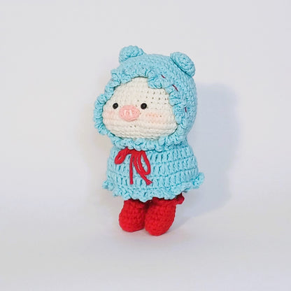 Handmade crochet of the adorable pig with a raincoat