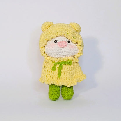 Handmade crochet of the adorable pig with a raincoat