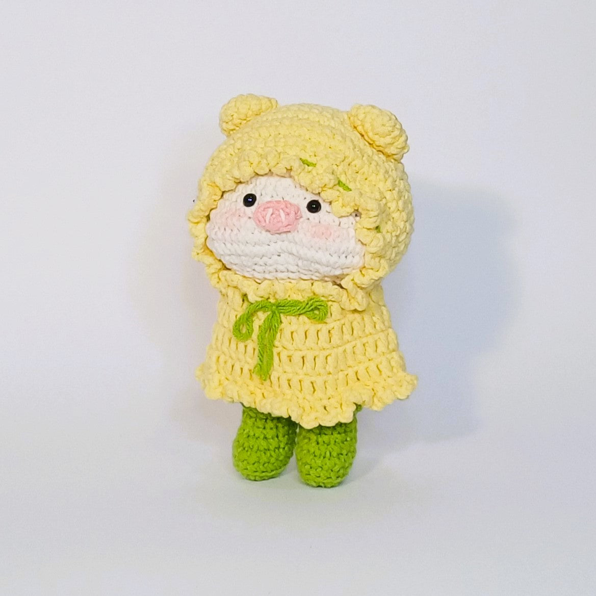 Handmade crochet of the adorable pig with a raincoat