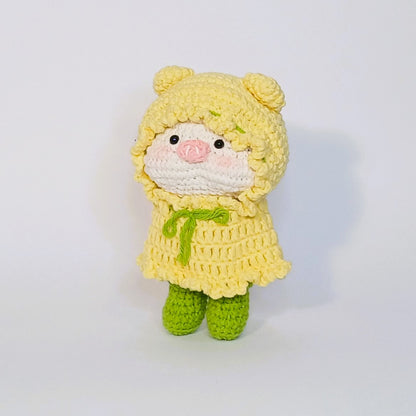 Handmade crochet of the adorable pig with a raincoat