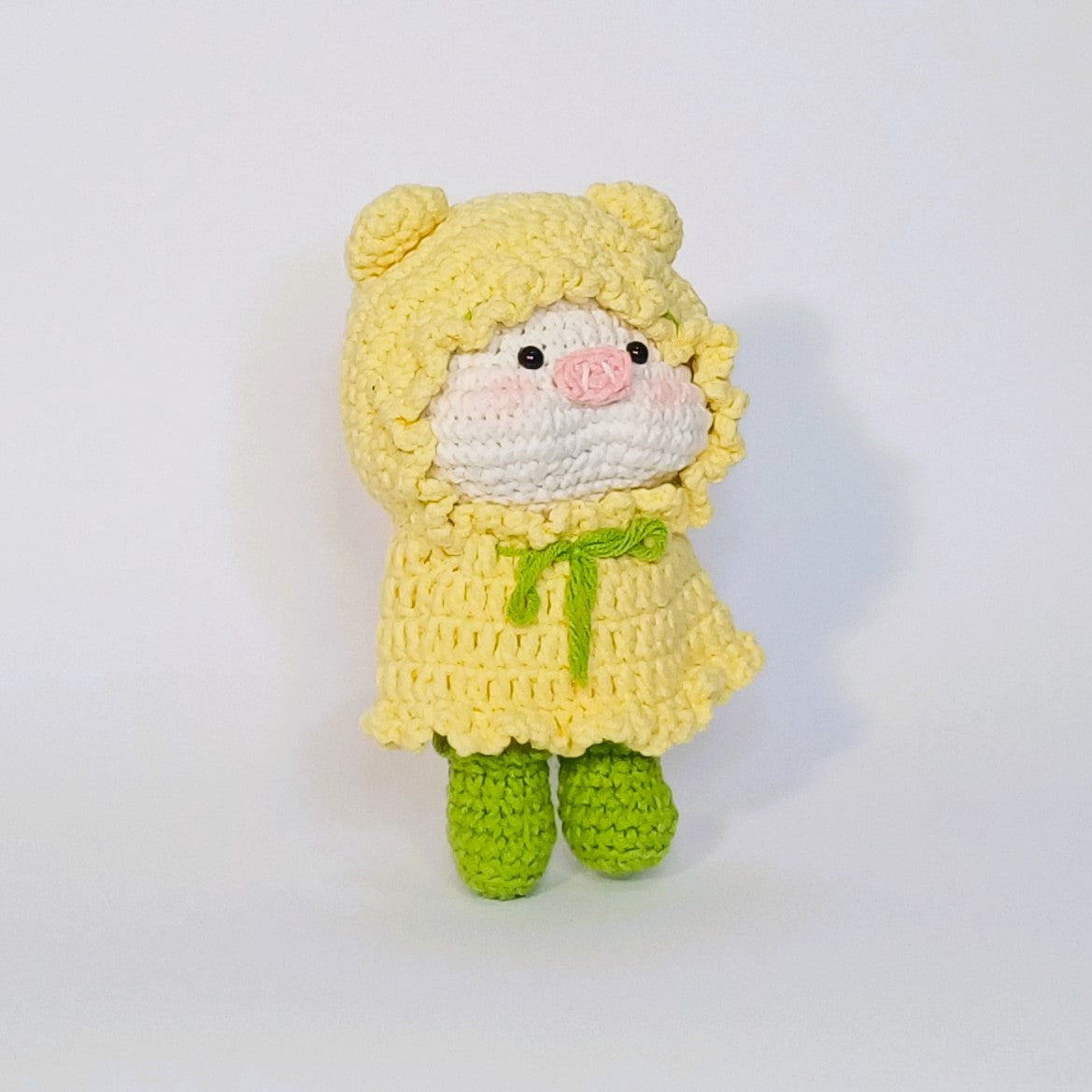 Handmade crochet of the adorable pig with a raincoat