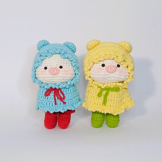 Handmade crochet of the adorable pig with a raincoat